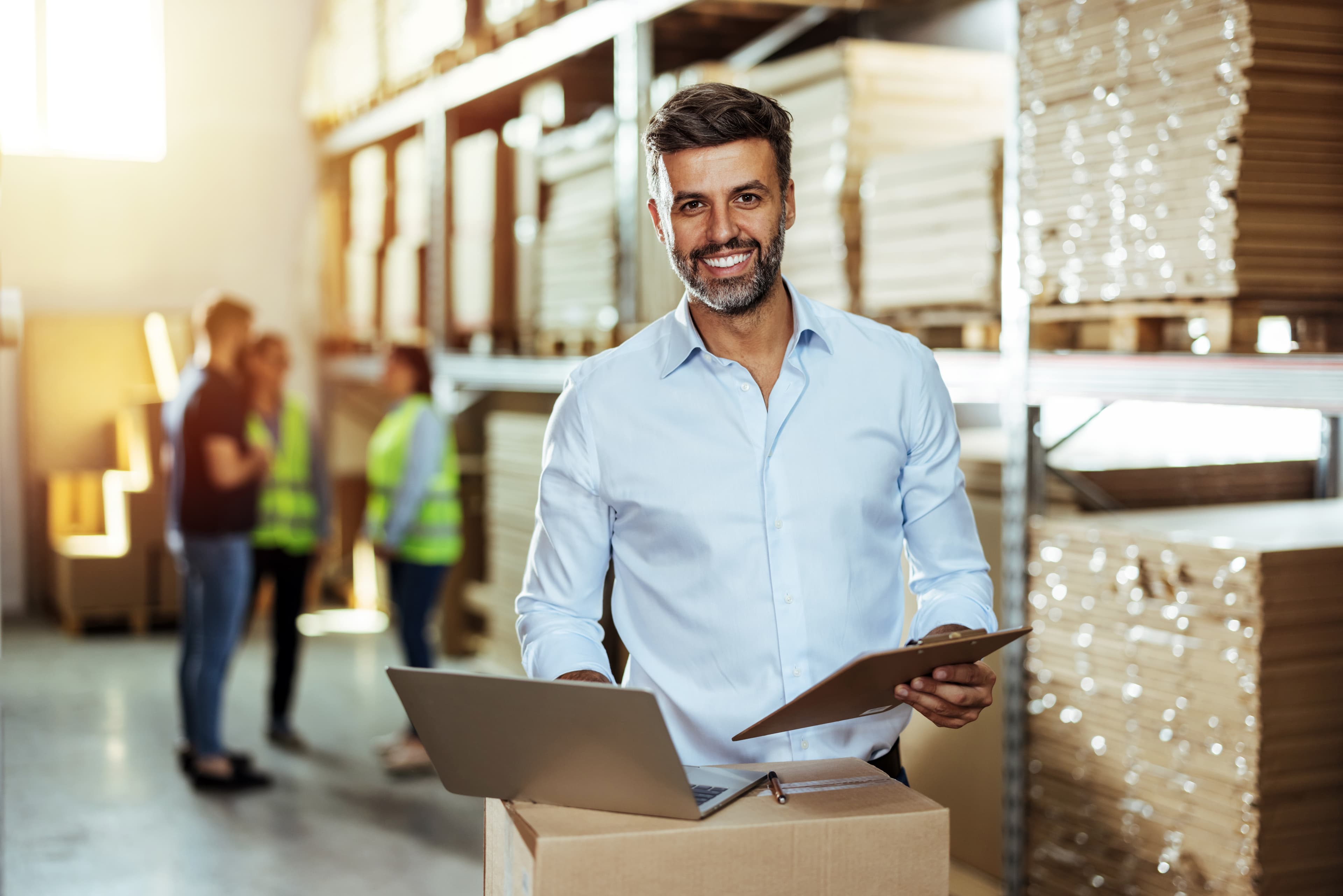 Man with tablet in a warehouse