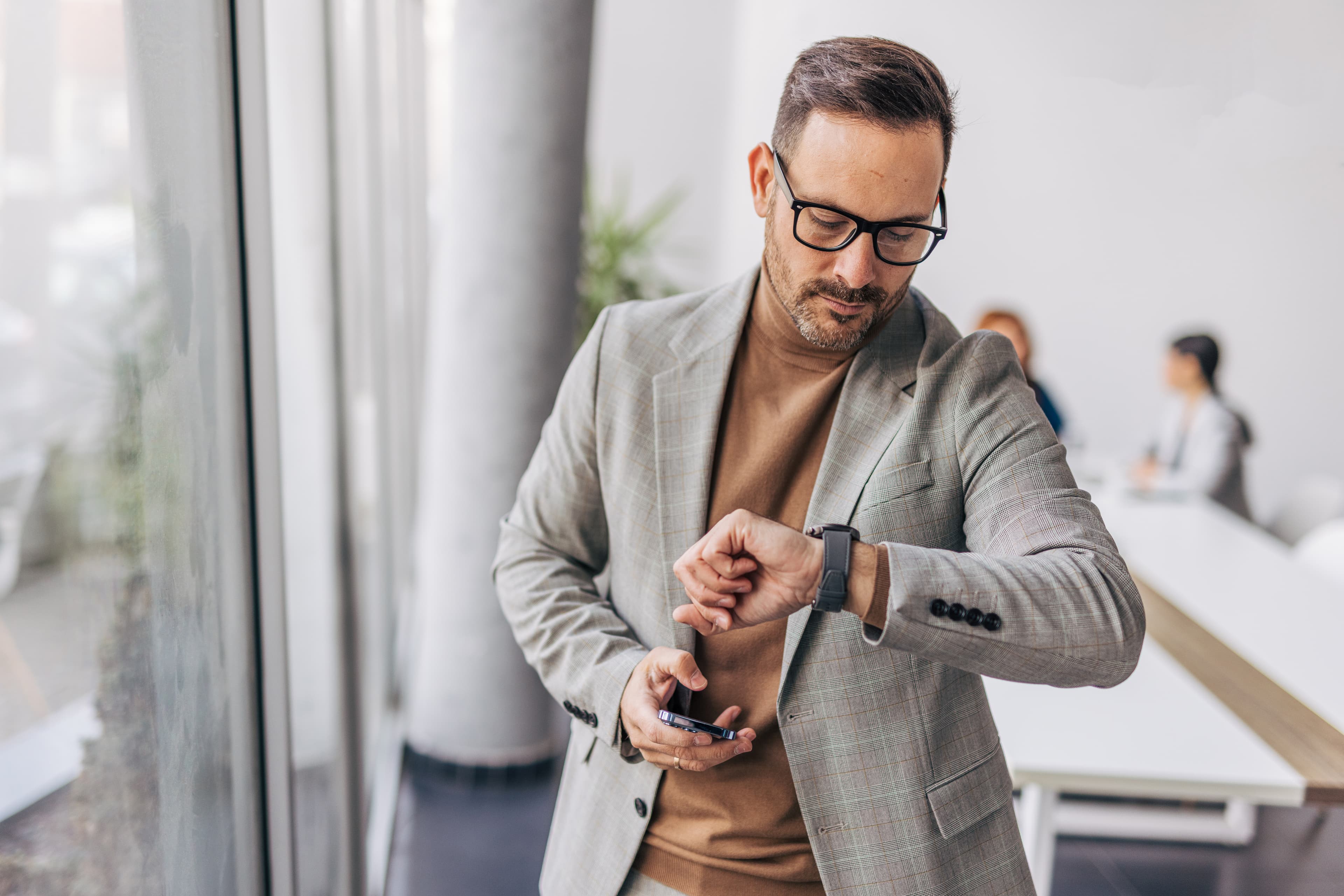 Business professionals discussing pension auto-enrolment